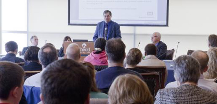 Participants listen to a speaker at public meeting. Photo by USFWS.